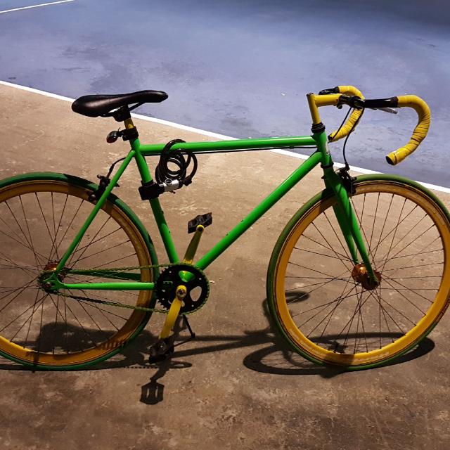 yellow fixed gear bike