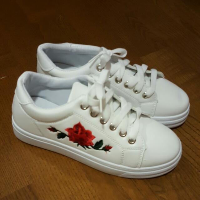 white embroidered shoes