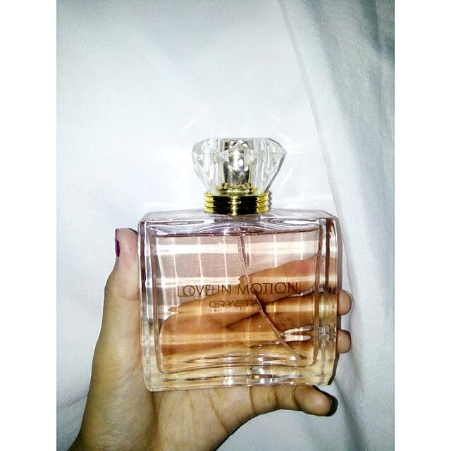 review parfum love in motion