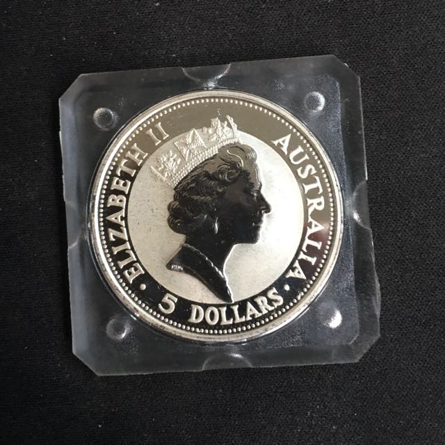 1991 Perth Mint Silver Kookaburra Coin (Category: Currency) located in Singapore. Submitted by coinsandstamps (Listing ID 105346161, Image 2). Description: 1oz 999 silver coin in original square capsule with box. Perfect condition. 2pcs available, price shown is for 1 pc..