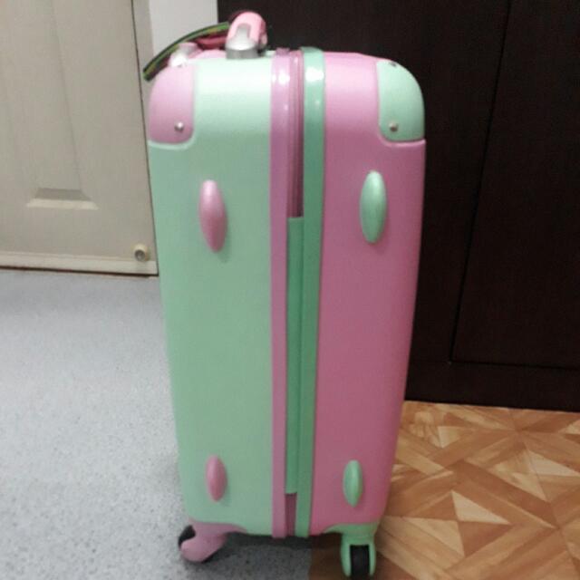 Pink and green luggage outlet