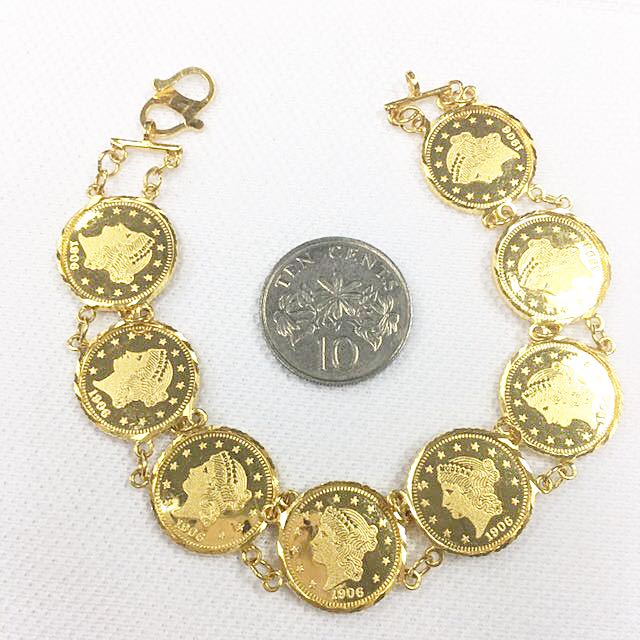 Gold bracelet with coins top