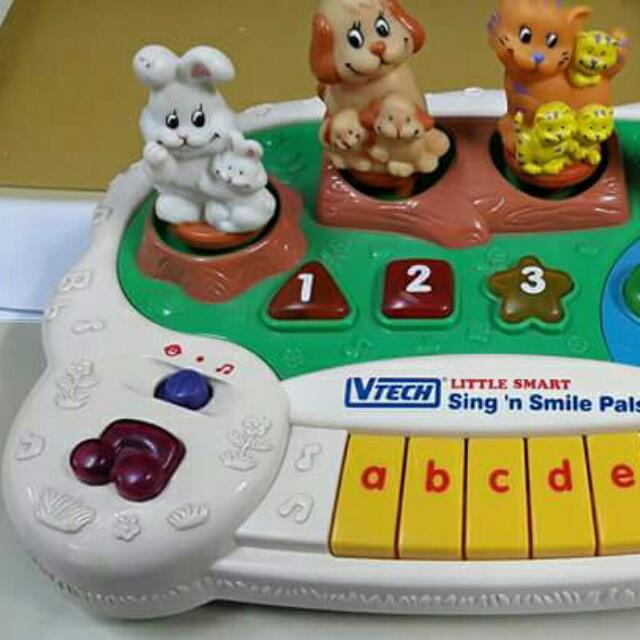 Vtech little smart sing n hot sale smile pals