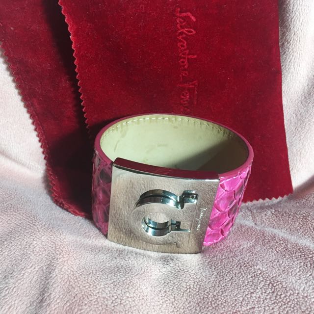 Authentic Salvatore Ferragamo Python Cuff (Category: Accessories) located in Singapore. Submitted by clearmythinggs (Listing ID 109291031, Image 1). Description: Exotic python snakeskin wrist cuff in pink Comes with box, paper bag, dust bag and receipt Retailed at $550 Preloved condition. Well taken care of. # bracelet arm band bangle wristlet armband cuff silver chrome hardware logo sf dustbag snake skin 📌Terms & Conditions ( please read before