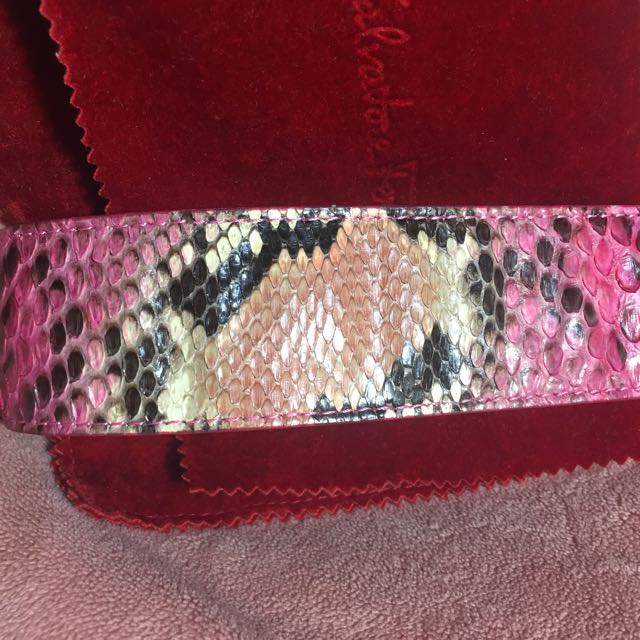 Authentic Salvatore Ferragamo Python Cuff (Category: Accessories) located in Singapore. Submitted by clearmythinggs (Listing ID 109291031, Image 2). Description: Exotic python snakeskin wrist cuff in pink Comes with box, paper bag, dust bag and receipt Retailed at $550 Preloved condition. Well taken care of. # bracelet arm band bangle wristlet armband cuff silver chrome hardware logo sf dustbag snake skin 📌Terms & Conditions ( please read before