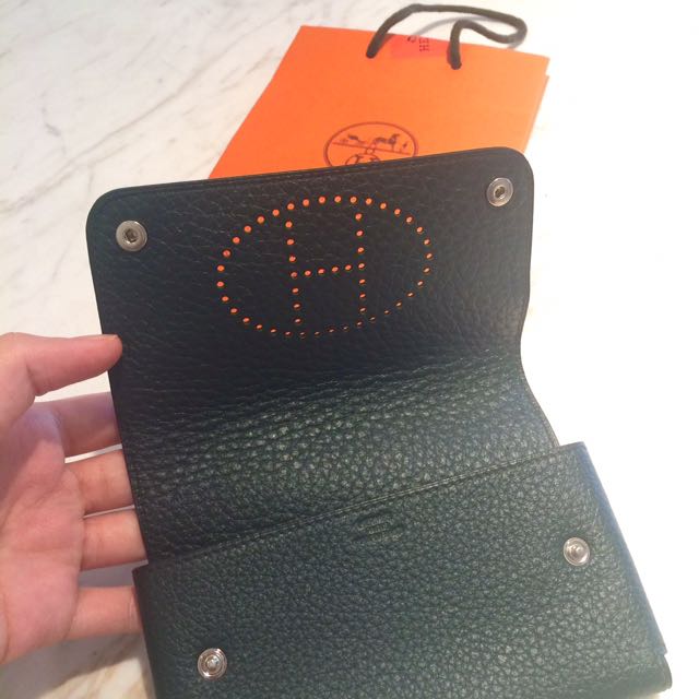 Authentic Hermes Multipurpose Wallet Passport Card Holder Phone Pouch Case (Category: Luxury Bags & Wallets) located in San Juan City. Submitted by akioza (Listing ID 109632294, Image 2). Description: Edit - - - Flying out to migrate in a weeks time. If we don't catch each other I'll need a friend to open my stuff in condo just to collect this if ev. So no time wasters PLS. Fits passports & mobile phone Etc. Paperbag included, looks more orange d