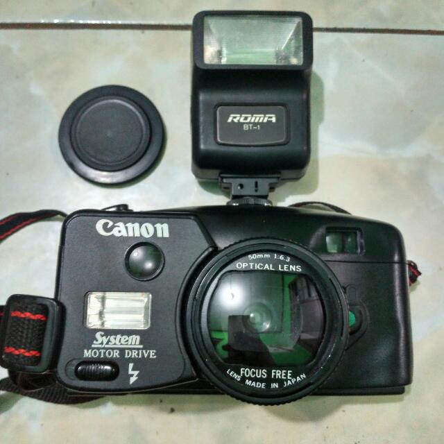 canon camera system motor drive kondisi mulus body lensa untested belom dicoba pakai film dan baterai nya include flash and leather bag