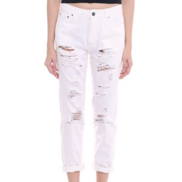 white ripped pants