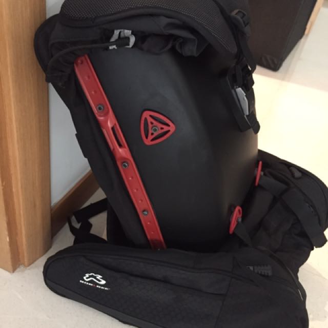 matte black and red boblbee backpack with many accessories