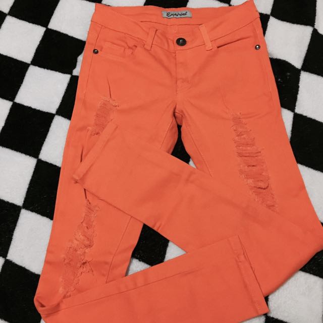 orange ripped jeans