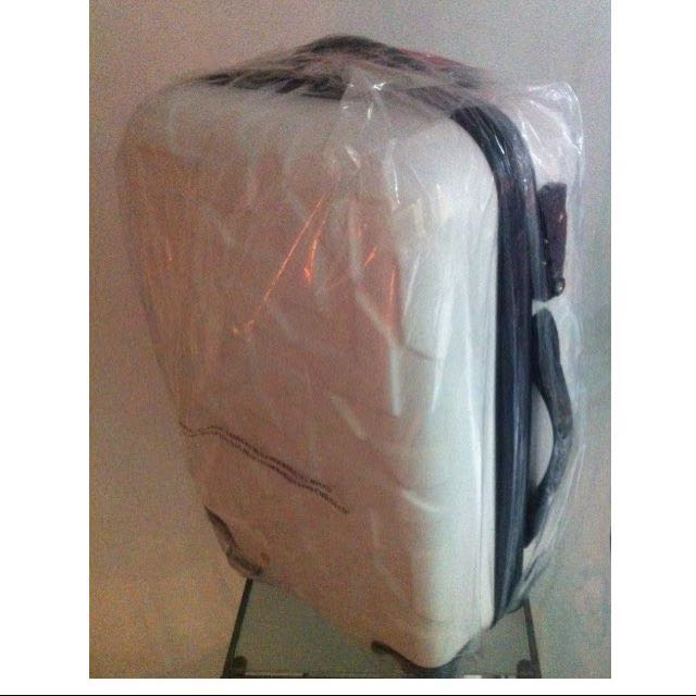 white cabin size suitcase