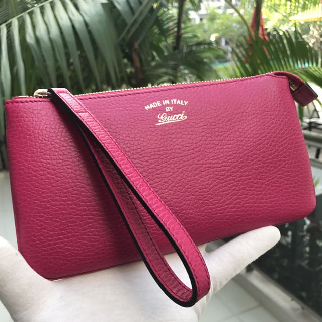 Pink gucci wristlet 2025