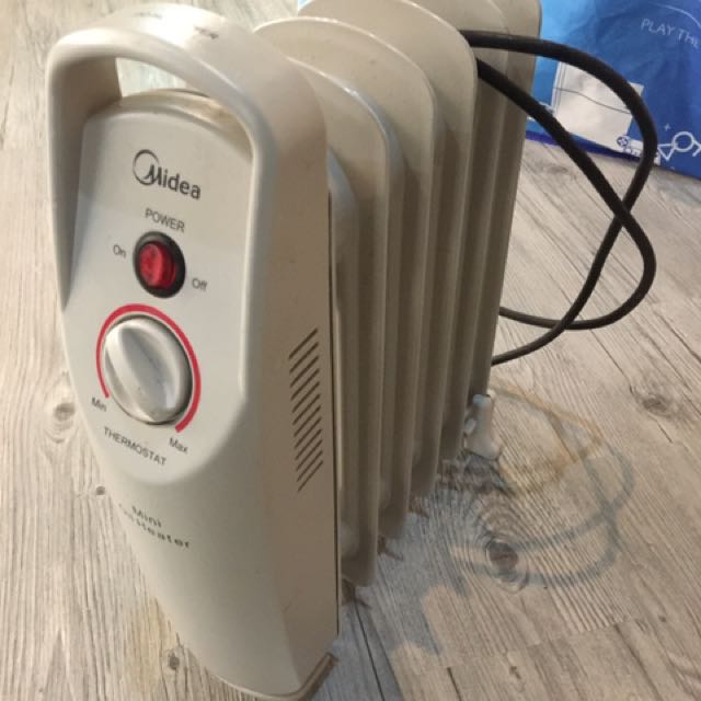 Midea NYP-6 美的迷你充油式電暖爐, 家庭電器, 冷氣機及暖風機- Carousell