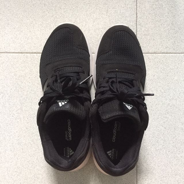 black running shoes with white soles