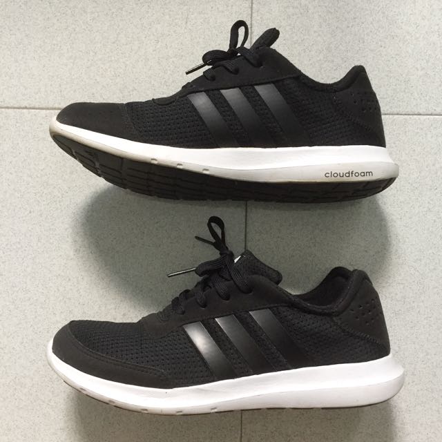 black running shoes with white soles