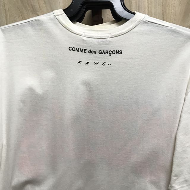 cdg x kaws