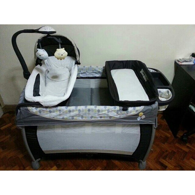 Ingenuity Washable Playard with Dream Center crib Babies