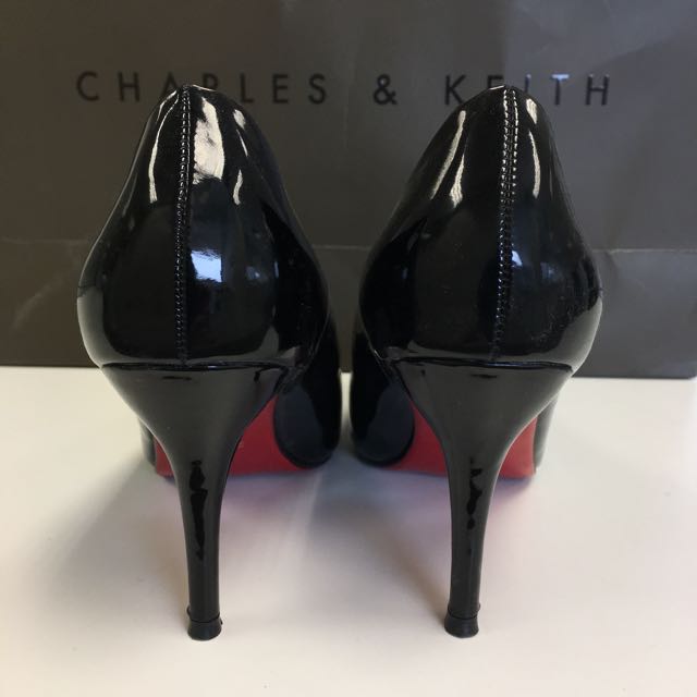 black stilettos with red soles