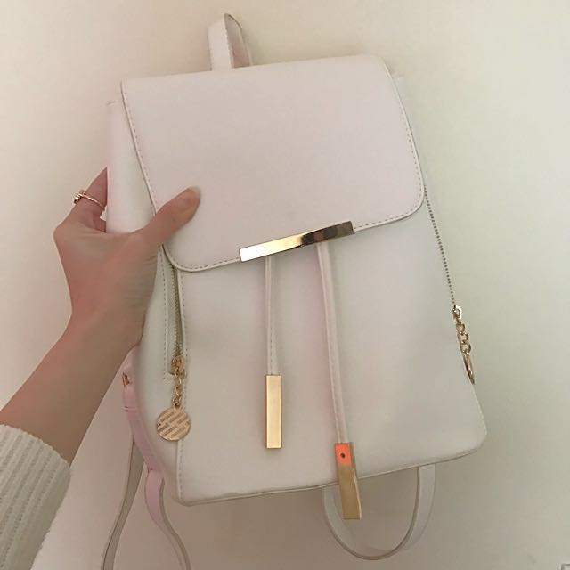 white faux leather backpack