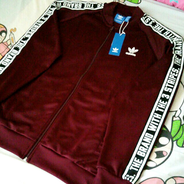 the brand with three stripes jacket