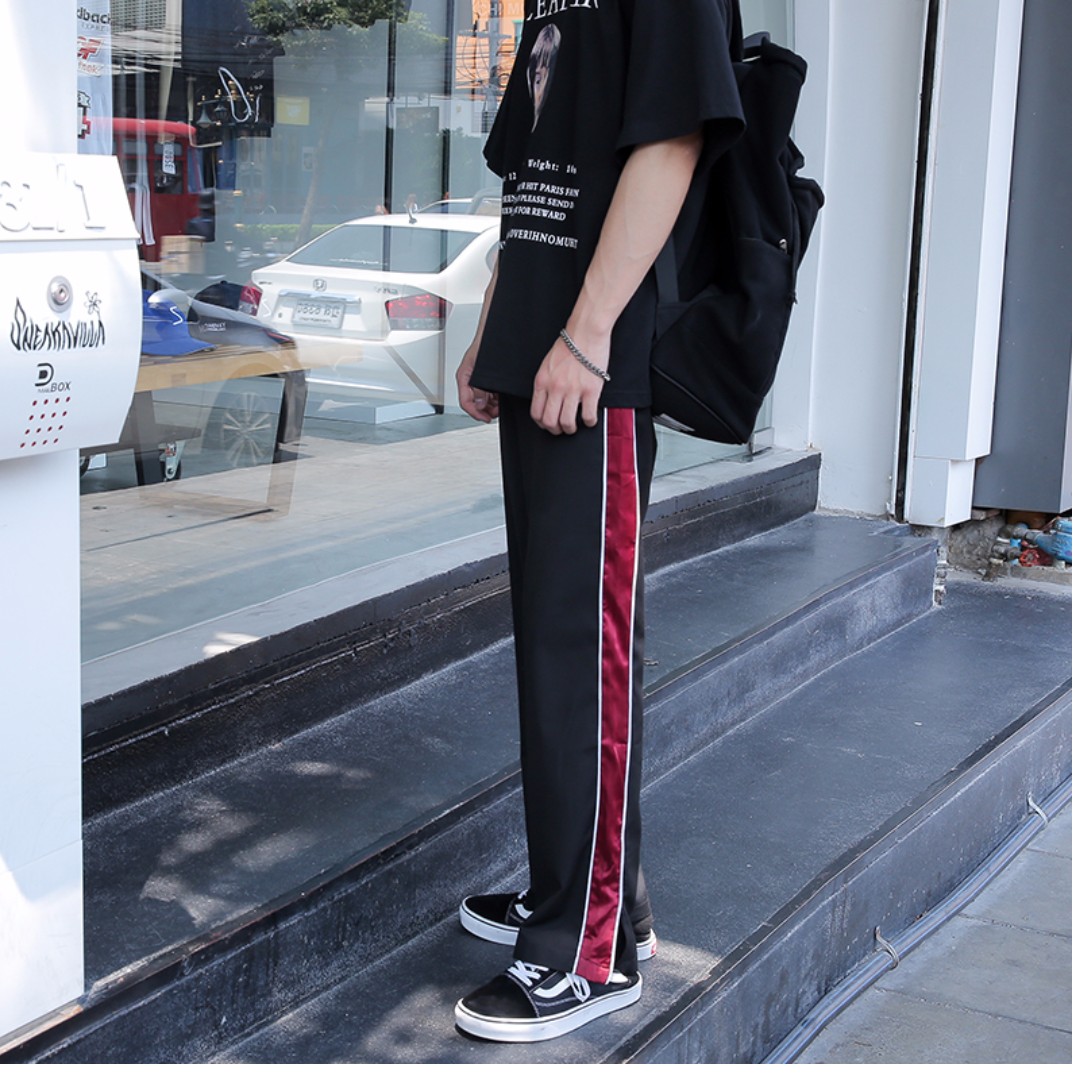 black pants with red side stripe