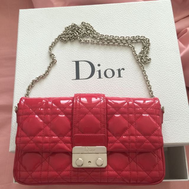 Neon pink store patent clutch bag
