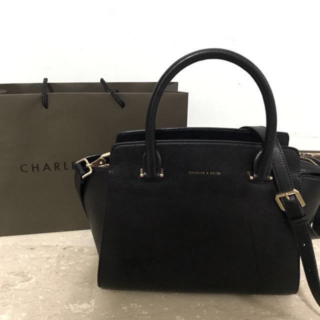 top handle trapeze bag