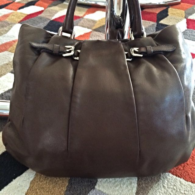 Prada -Authentic (Category: Bags & Wallets) located in Singapore. Submitted by jamiel_7337 (Listing ID 45264355, Image 2). Description: Lamb skin . Excellent condition used with care for 3 days during Xmas. a bit small for me with young child No Trade.