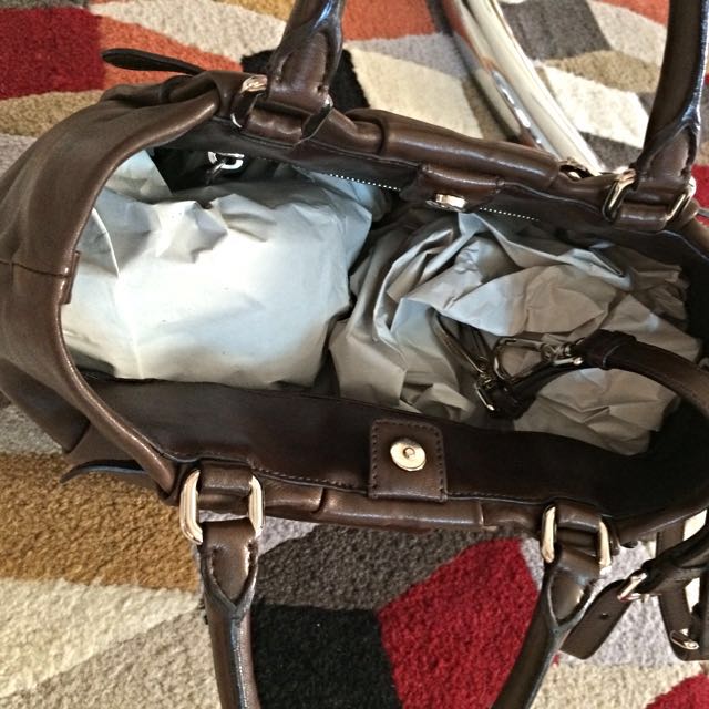 Prada -Authentic (Category: Bags & Wallets) located in Singapore. Submitted by jamiel_7337 (Listing ID 45264355, Image 3). Description: Lamb skin . Excellent condition used with care for 3 days during Xmas. a bit small for me with young child No Trade.