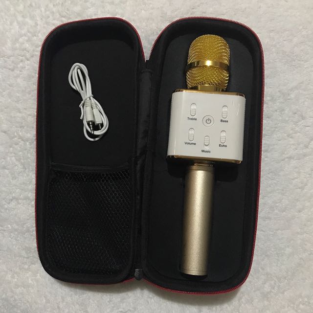 Portable wireless mic (Gold) (Category: Portable Audio Accessories) located in Pasig City. Submitted by closetqueen8888 (Listing ID 132904527, Image 1). Description: Portable wireless mic (Gold) . Condition: Like new, used just to test then stored Perfect for karaoke with friends . Price: P1,500 Plus grab car delivery fee . RFS: Impulsive purchase .