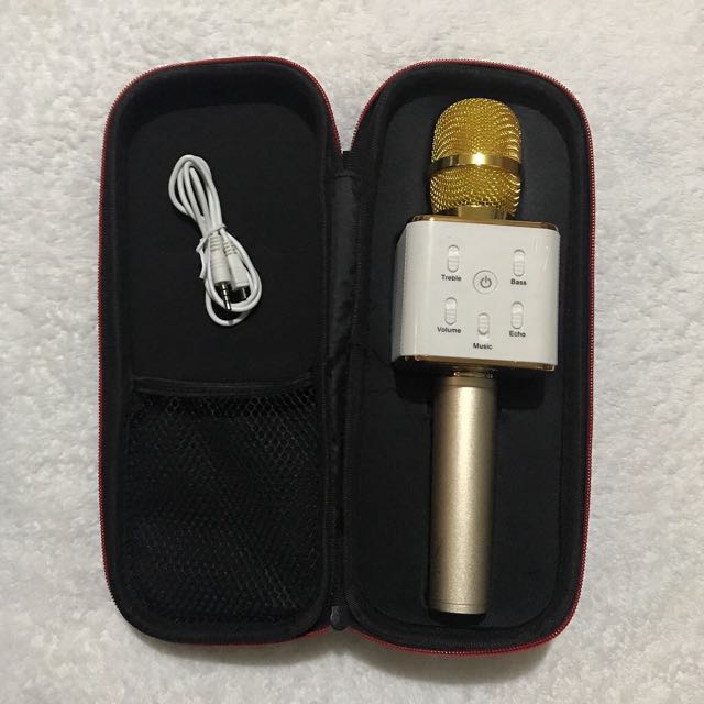 Portable wireless mic (Gold) (Category: Portable Audio Accessories) located in Pasig City. Submitted by closetqueen8888 (Listing ID 132904527, Image 3). Description: Portable wireless mic (Gold) . Condition: Like new, used just to test then stored Perfect for karaoke with friends . Price: P1,500 Plus grab car delivery fee . RFS: Impulsive purchase .
