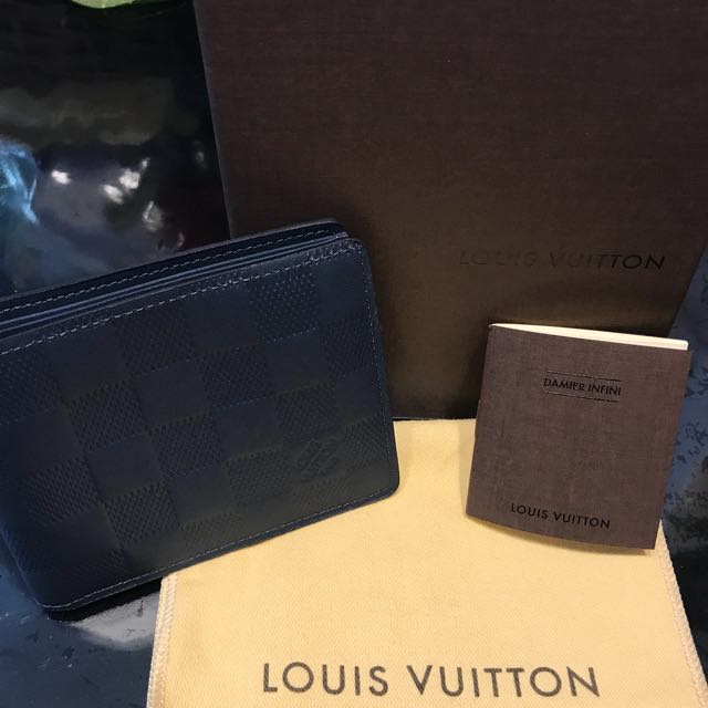 Discover Louis Vuitton Slender Wallet: Slender by name, slender by nature.  This wallet in refined Damier Infini leather i…