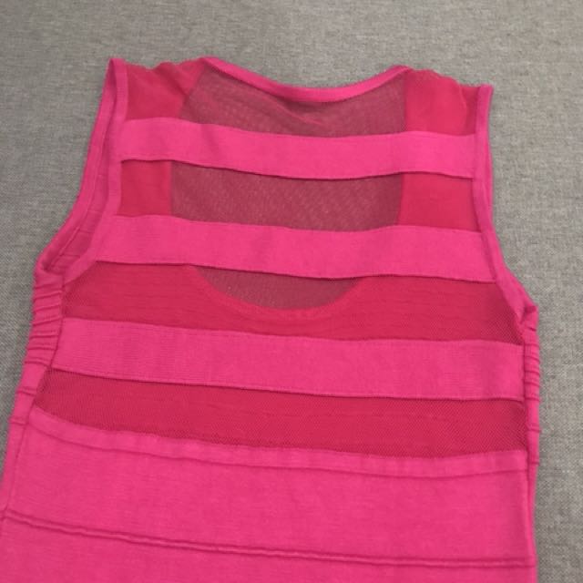 Hot pink bandage dress (Category: Dresses) located in Pasig City. Submitted by cescascloset (Listing ID 134444072, Image 3). Description: Brand new hot pink bandage dress with mesh back detail Bought from SOFA Retail Lab for Php 1,500 Fits size small.