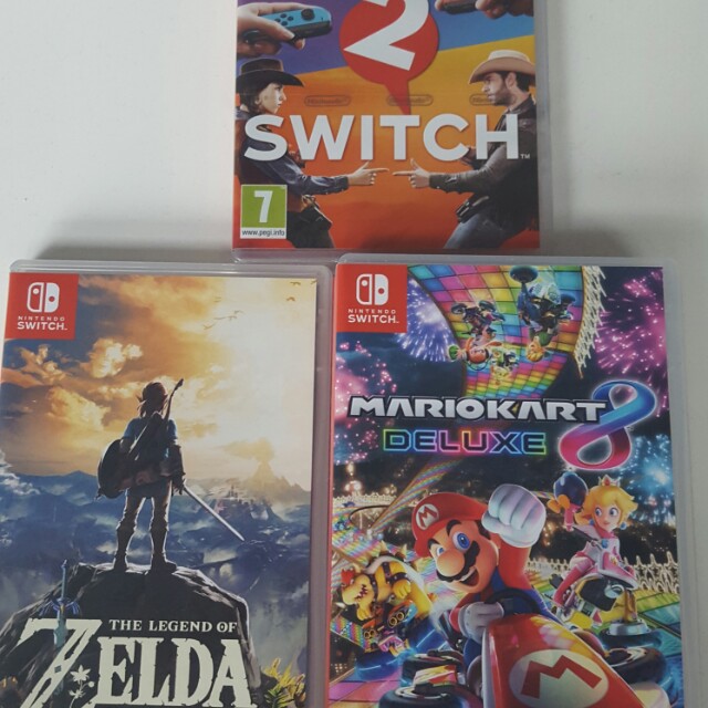 nintendo switch with zelda and mario kart