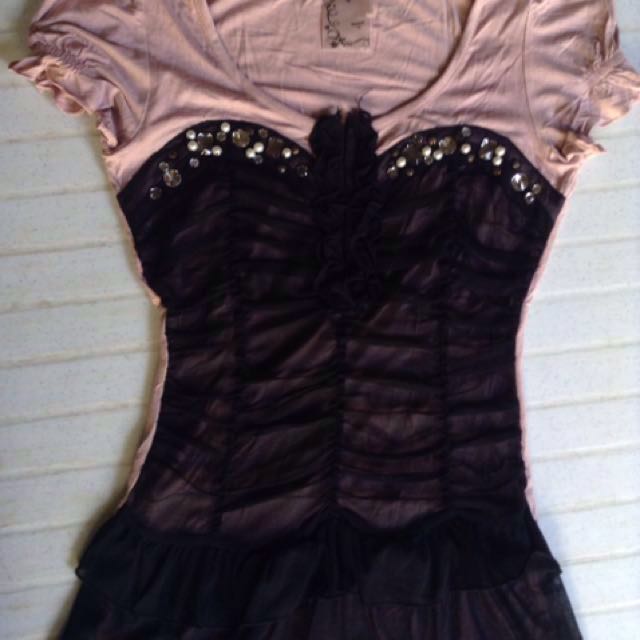 Next corset look top (Category: Others Tops) located in Butuan. Submitted by krishaun (Listing ID 134942634, Image 1). Description: Corset Look Blouse/ Top Brand: Next Used once and stored for sometime Color: Old Rose and Black With embellishment Puffed sleeves Unique and cute in actual Size indicated: 10 Can fit to small- semi large frame Measurement in inches when laid flat: Shoulder-shoulder: 13" Armpit-armpit: 16" Armhole: 7 1/2" Length: 25" 