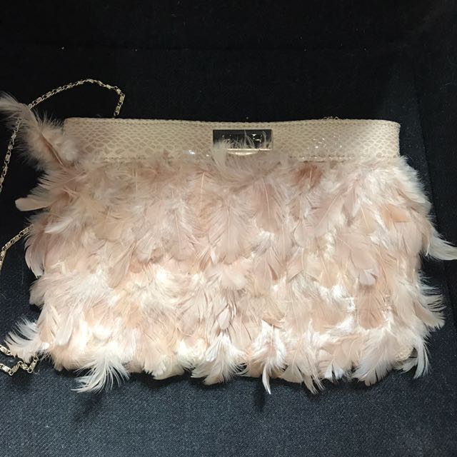 white feather clutch bag