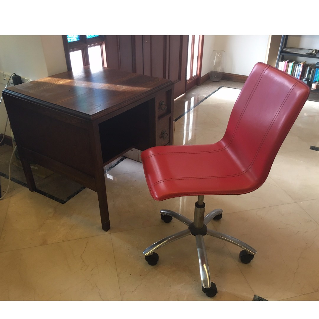 wooden small desk with red chair