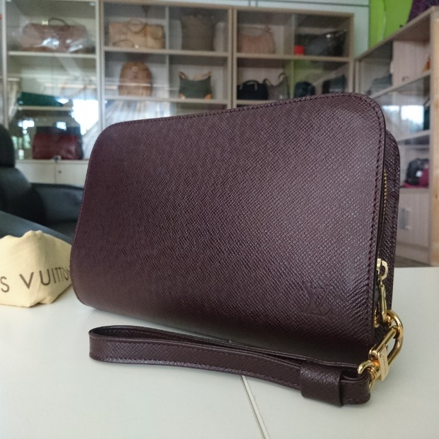 Louis Vuitton, Bags, Authenticity Guaranteed Louis Vuitton Taiga Baikal Clutch  Bag Green Lv