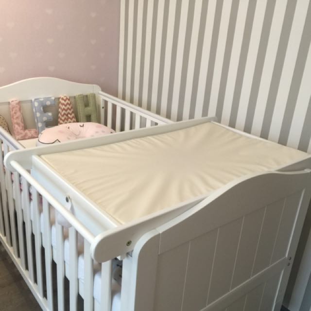 baby cot and changing table