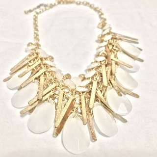 Chunky white and gold tone statement necklace