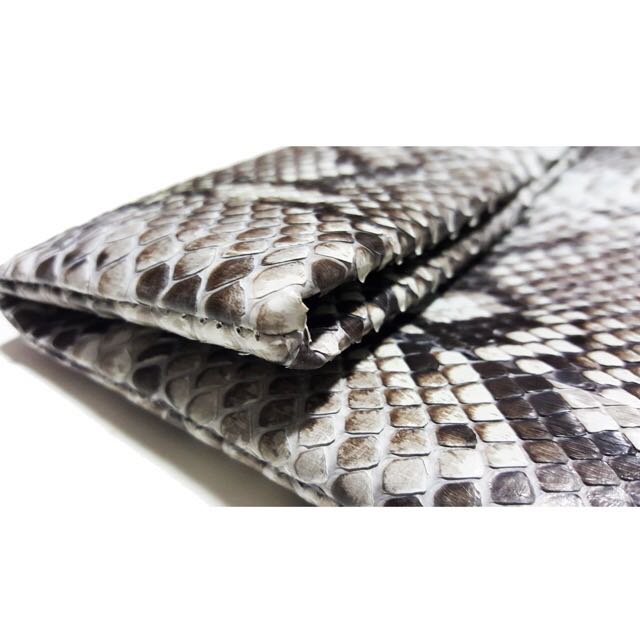 Genuine python envelop clutch (Category: Other Accessories) located in Singapore. Submitted by starryz (Listing ID 139384146, Image 1). Description: Item Details: - Full-Grain Genuine Python belly Leather and fully lined with leather - Interior card pocket - Flap secured with magnetic closure - Handcrafted with love Condition: New Size: 10" W "x 6" H Reasons Why You Should Get This: Looking for a unique accessory to compliment your upcoming Chris