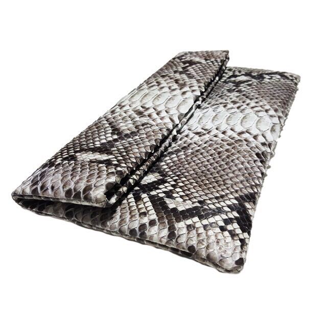 Genuine python envelop clutch (Category: Other Accessories) located in Singapore. Submitted by starryz (Listing ID 139384146, Image 3). Description: Item Details: - Full-Grain Genuine Python belly Leather and fully lined with leather - Interior card pocket - Flap secured with magnetic closure - Handcrafted with love Condition: New Size: 10" W "x 6" H Reasons Why You Should Get This: Looking for a unique accessory to compliment your upcoming Chris