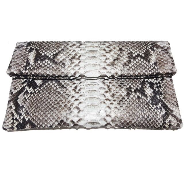 Genuine python envelop clutch (Category: Other Accessories) located in Singapore. Submitted by starryz (Listing ID 139384146, Image 2). Description: Item Details: - Full-Grain Genuine Python belly Leather and fully lined with leather - Interior card pocket - Flap secured with magnetic closure - Handcrafted with love Condition: New Size: 10" W "x 6" H Reasons Why You Should Get This: Looking for a unique accessory to compliment your upcoming Chris