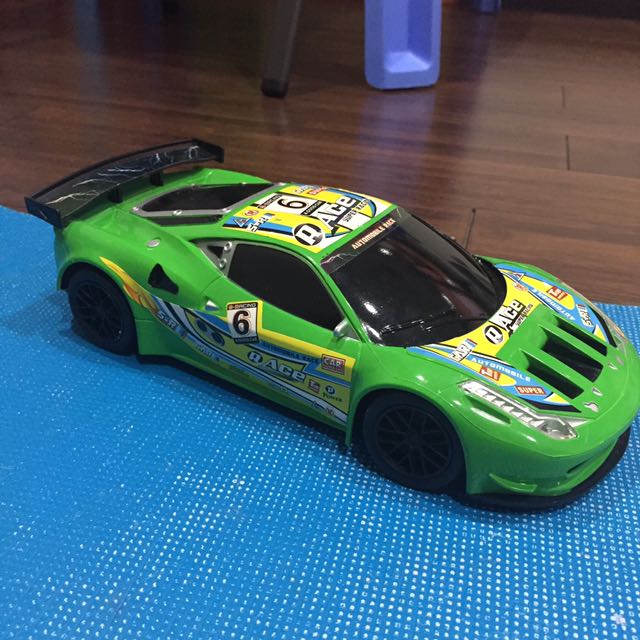 Green Race Car Babies Kids Toys Walkers On Carou Photo