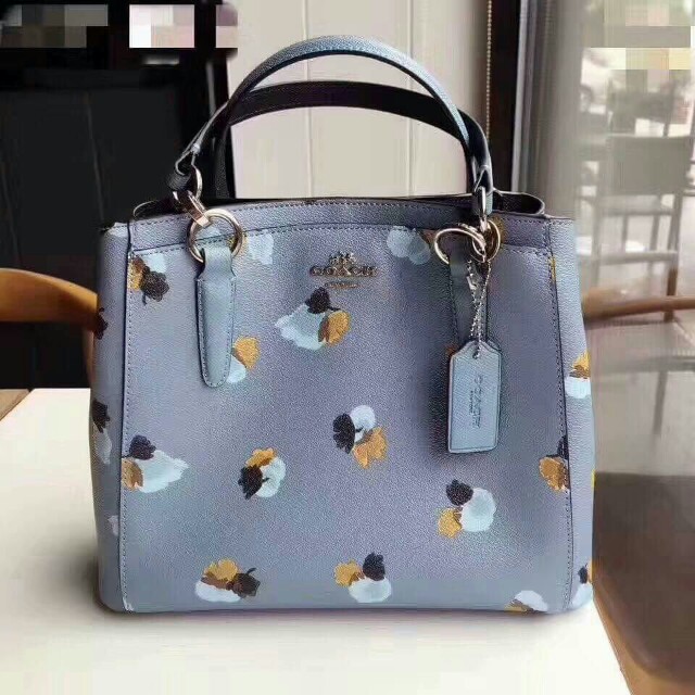 blue coach purse with flowers