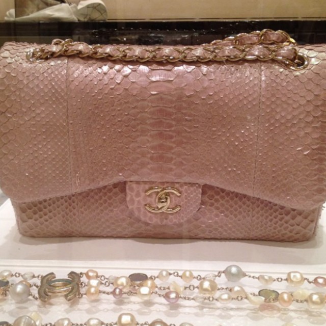 Authentic Chanel Pink Python Handbag (Category: Bags & Wallets) located in Singapore. Submitted by priced.to.sell (Listing ID 141583107, Image 1). Description: Size: Medium Color: Pink Condition: Good Exotic Python Skin (Chanel is not producing exotic skin anymore) Bought in Europe in 2012 Used a few times and not abused Comes with full box, dustbag, authenticity card and receipt Can verify at any Chanel boutique for authenticity View to offer.