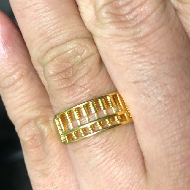 Abacus gold cheap ring meaning
