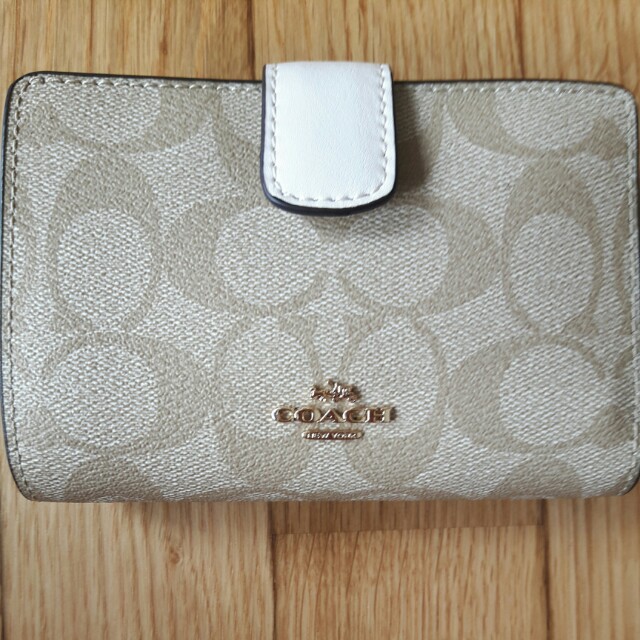 coach wallet cost