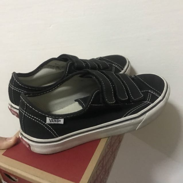 All black vans with white top stripe