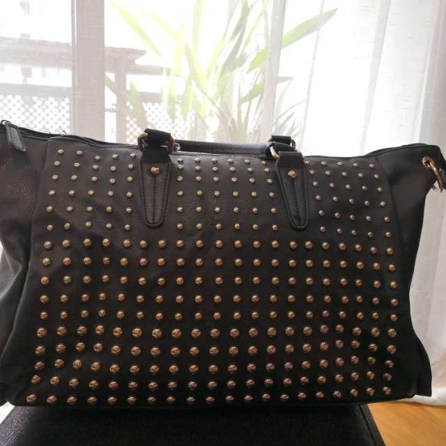 black purse with gold studs